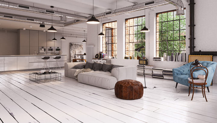 open Space Wohnbereich mit alten Fussboden und moderner Küche